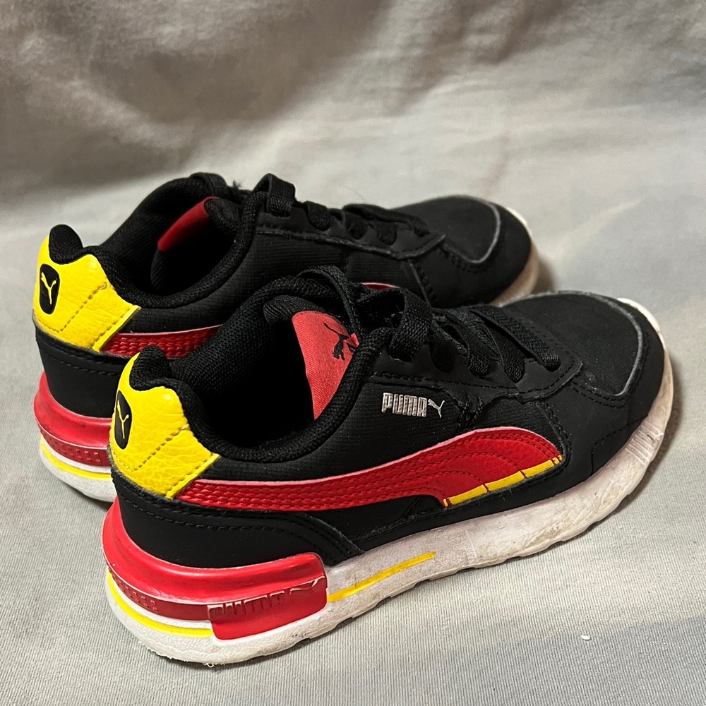 Puma Kids Black, Red, and Yellow Sneakers